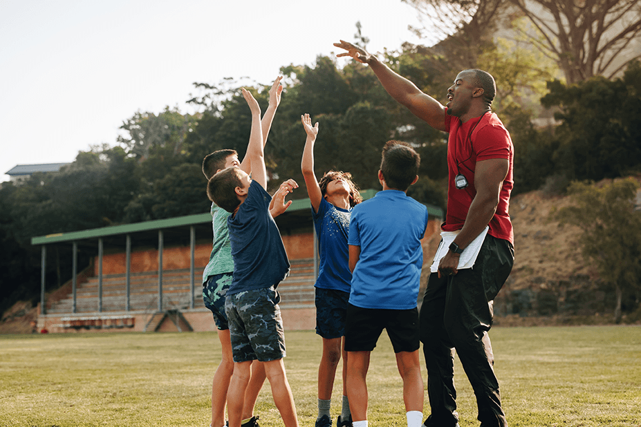 coach with football team