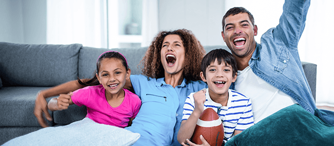 family cheering football game